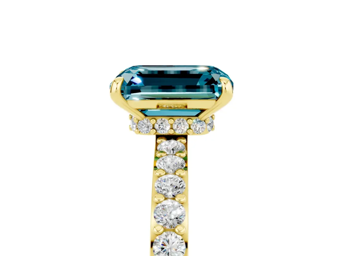 Emerald Cut Blue Topaz Solitaire Engagement Ring with Pavé Band and Four-Prong Setting Yellow gold