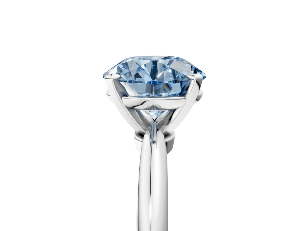 Fancy Blue Round Cut Diamond Solitaire Ring with Six-Prong Setting and Classic Band Platinum