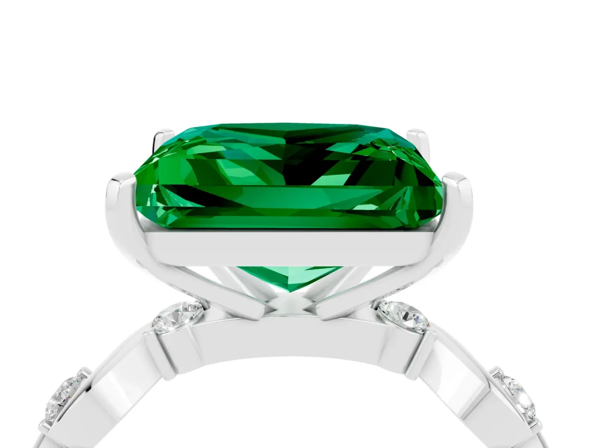 Princess Cut Emerald Solitaire Twisted Band with Round Accents and Prong Setting Silver