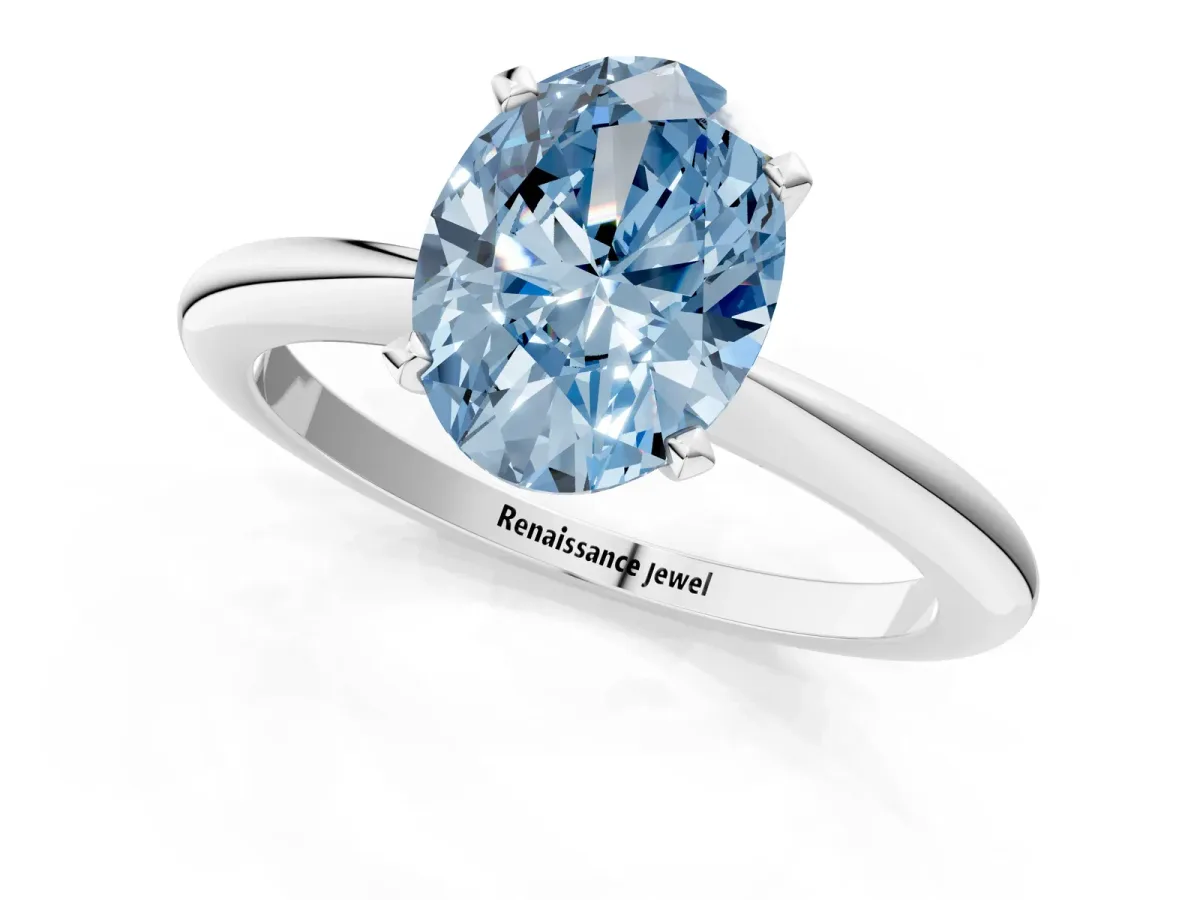 Fancy Blue Oval Cut Diamond Solitaire Ring with Six-Prong Setting and Classic Band Silver