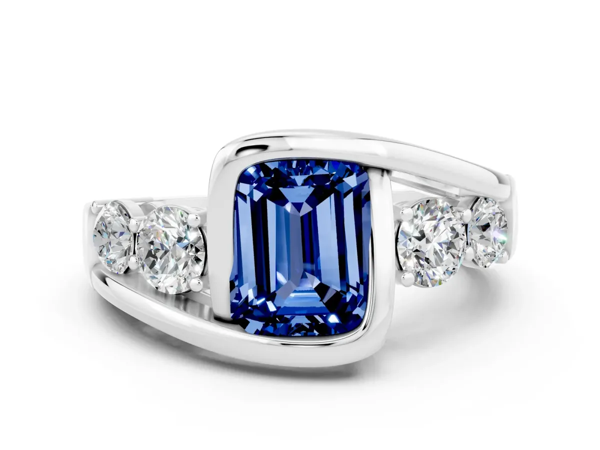 Bezel Set Emerald Cut Blue Sapphire Bypass Ring with Round Accents Silver