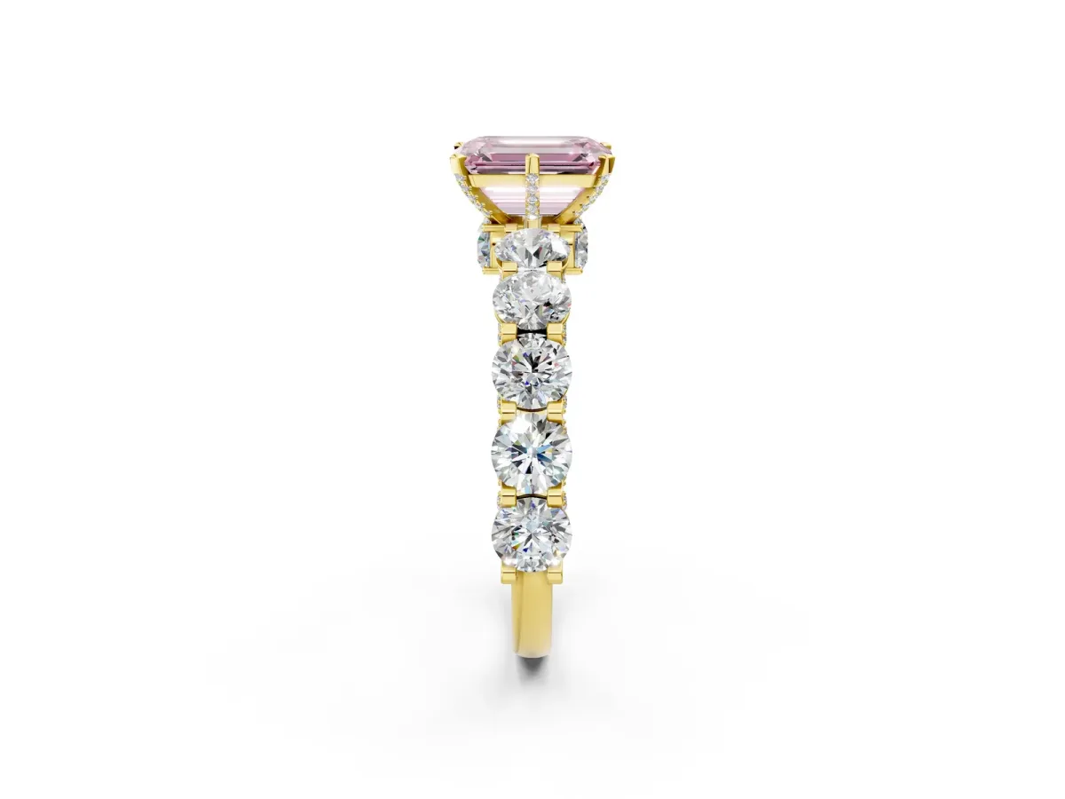 Fancy Pink Emerald Cut Diamond Side Stone Engagement Ring with Four-Prong Setting Yellow gold