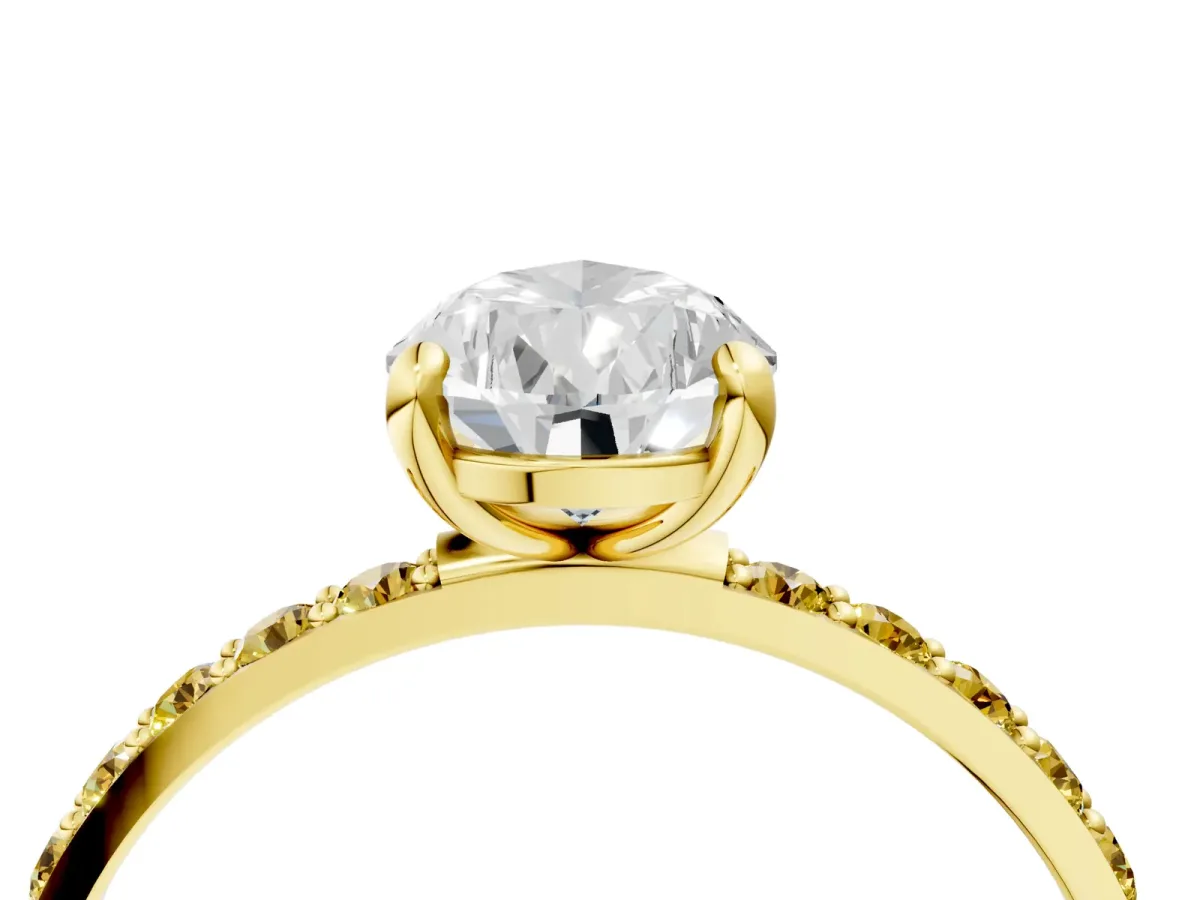 Pear Cut Diamond Solitaire Ring with Round Yellow Sapphire Pavé Band and Prong Setting Yellow gold