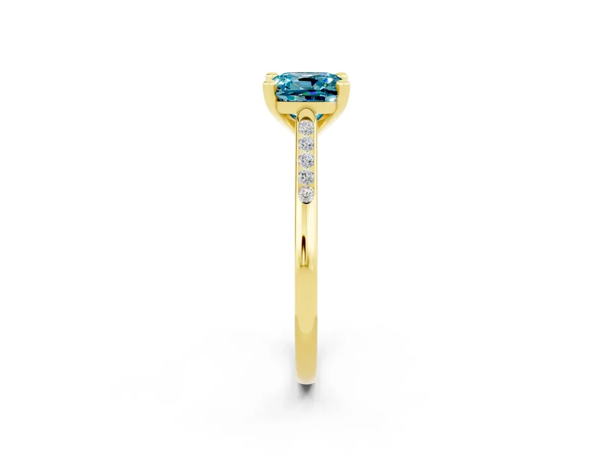 Cushion Cut Blue Topaz Solitaire Ring with Channel Set Round Band and Prong Setting Yellow gold
