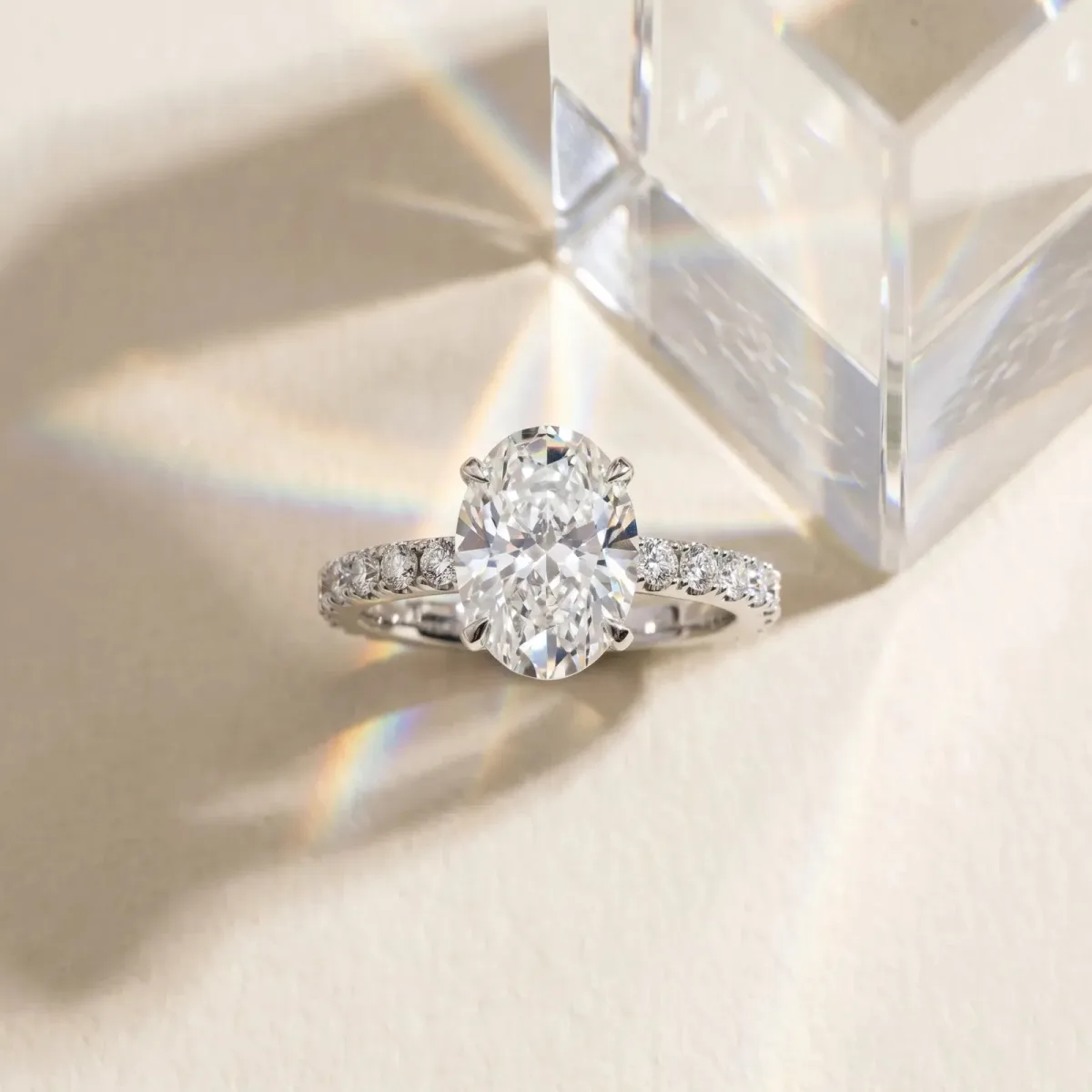 Oval Cut Diamond Solitaire Pavé Band with Four-Prong Setting Silver