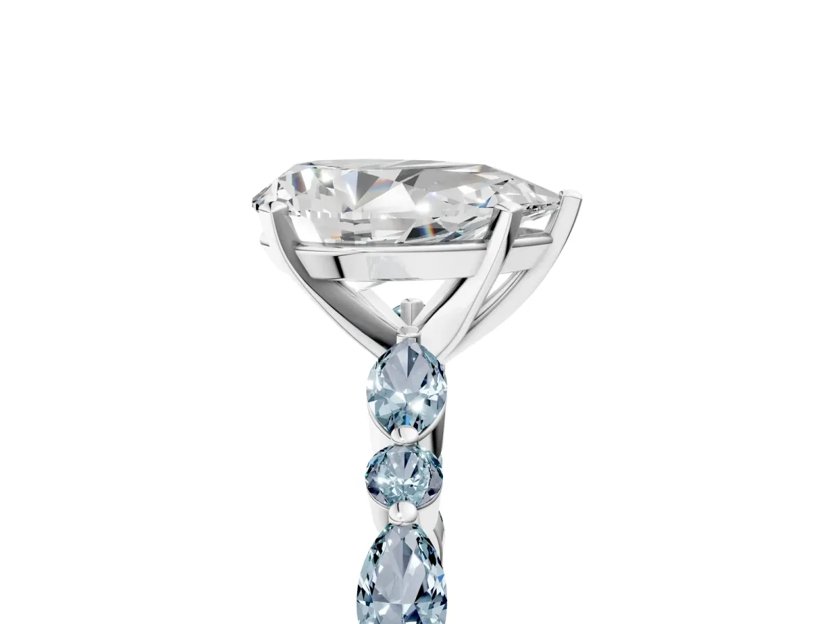 Pear Cut Diamond Ring with Marquise and Round Aquamarine Side Stones and Four-Prong Setting White gold
