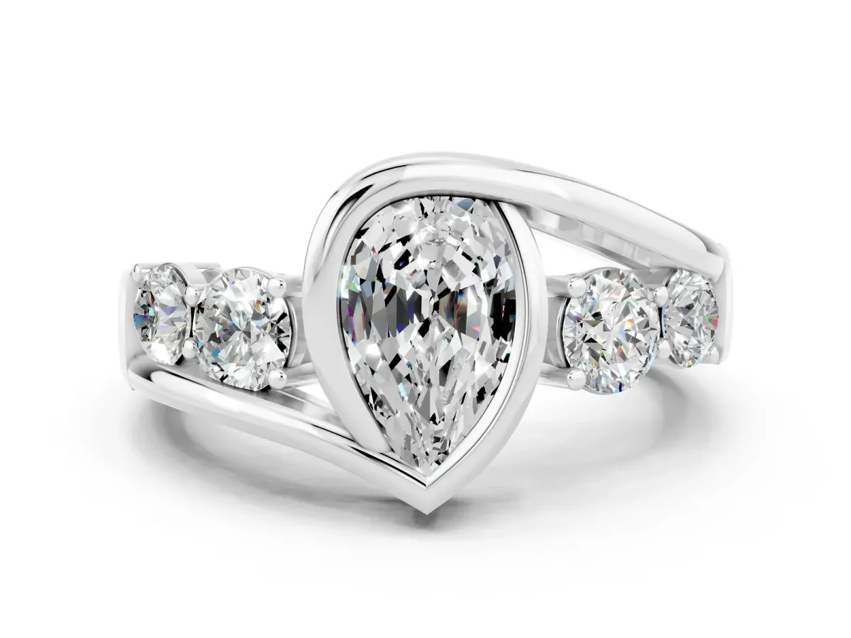 Bezel Set Pear Cut Moissanite Bypass Ring with Round Accents Platinum