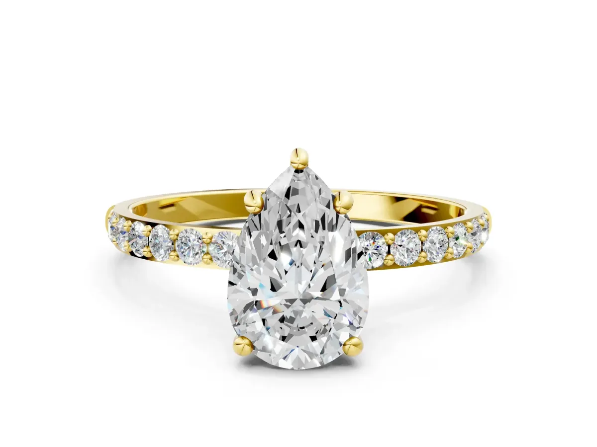 Pear Cut Diamond Solitaire Ring with Round Moissanite Pavé Band and Prong Setting Yellow gold