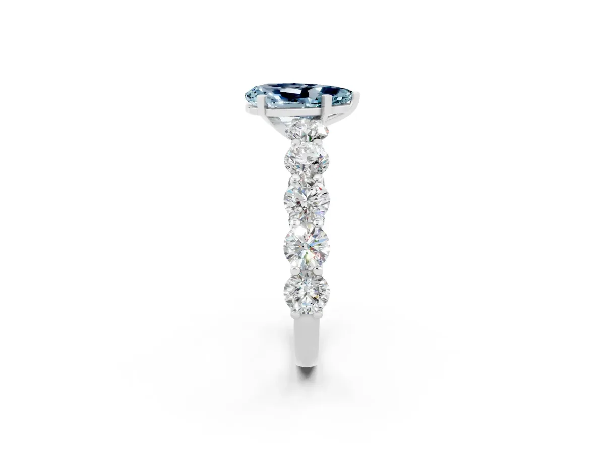 Pear Cut Aquamarine Prong Setting with Side Stones on a Pave Band Silver