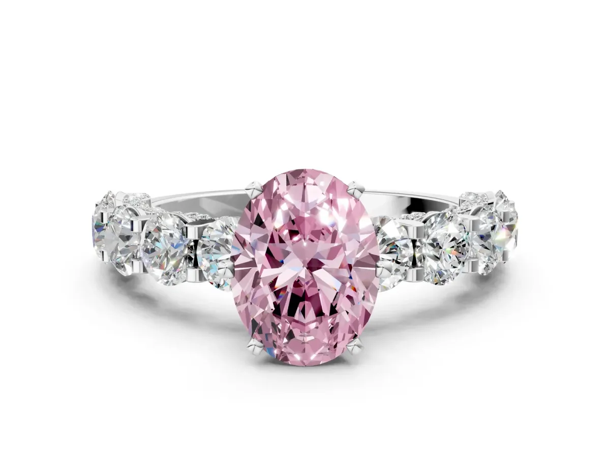 Fancy Pink Oval Cut Diamond Side Stone Engagement Ring with Four-Prong Setting Platinum
