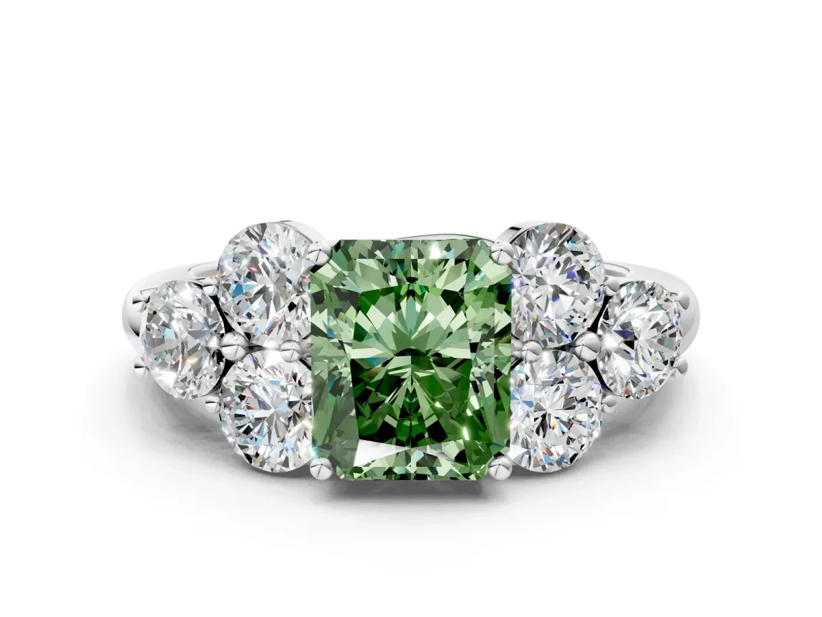 Fancy Green Radiant Cut Cut Diamond Cluster Ring with Round Accent Stones and Prong Setting on a Classic Band Platinum