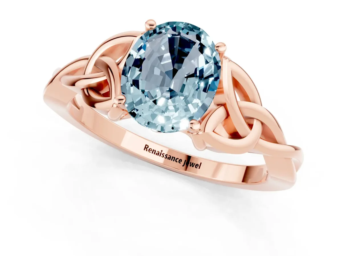 Oval Cut Aquamarine Solitaire Engagement Ring with Celtic Knot Band and Four-Prong Setting Rose gold