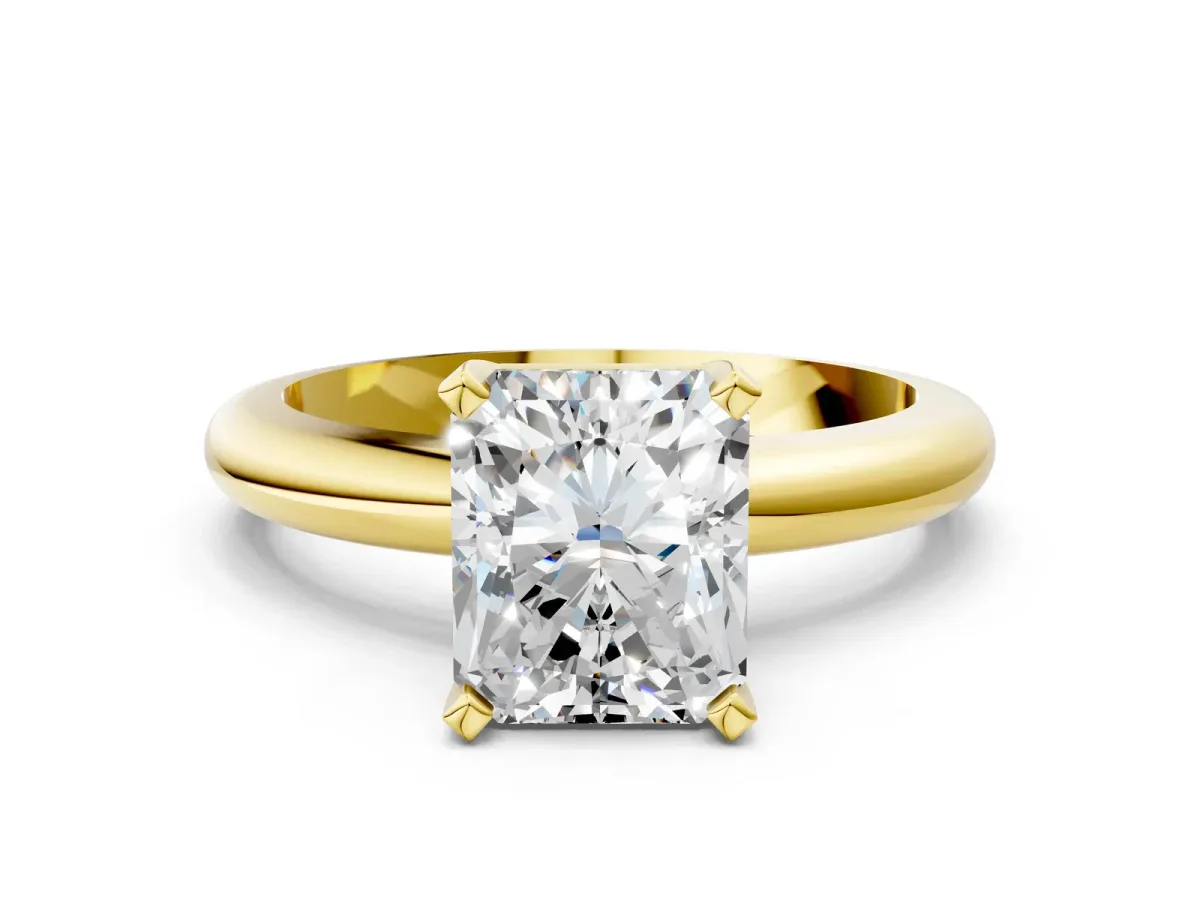 Radiant Cut Diamond Solitaire Engagement Ring with Round Band and Four-Prong Setting Yellow gold