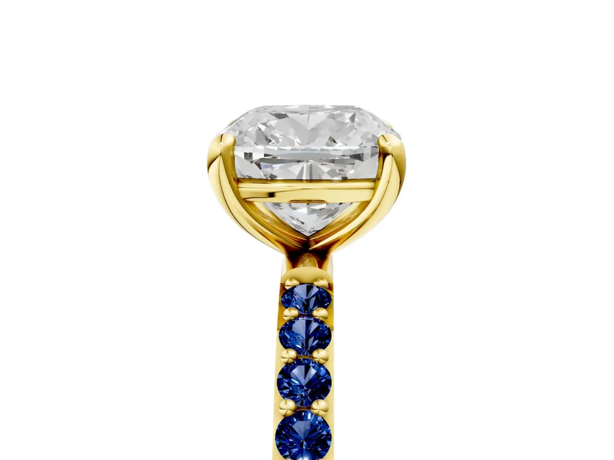 Cushion Cut Diamond Solitaire Ring with Round Blue Sapphire Pavé Band and Prong Setting Yellow gold