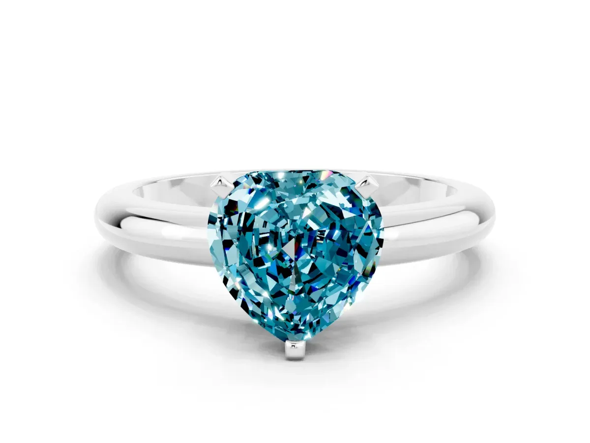 Heart Cut Blue Topaz Solitaire Engagement Ring with Round Band and Four-Prong Setting White gold