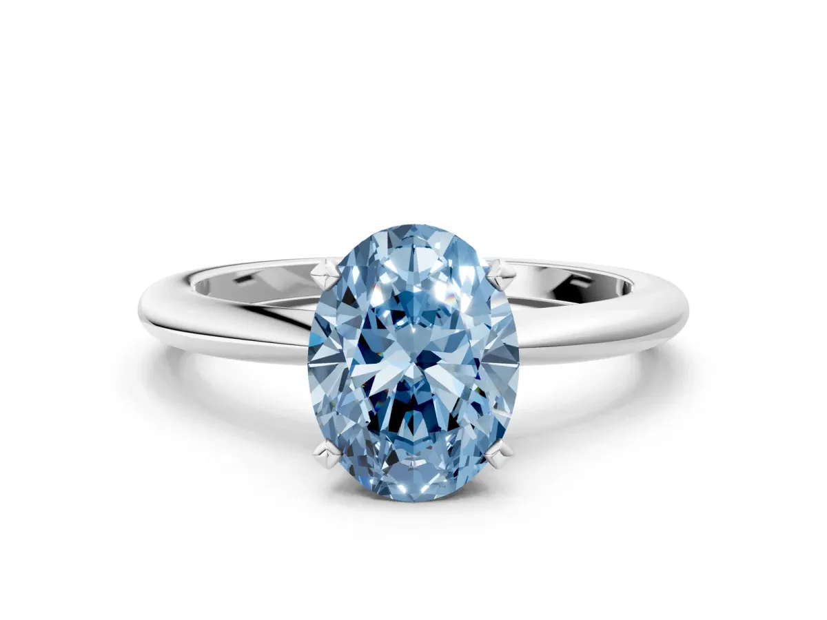 Fancy Blue Oval Cut Diamond Solitaire Ring with Six-Prong Setting and Classic Band Silver