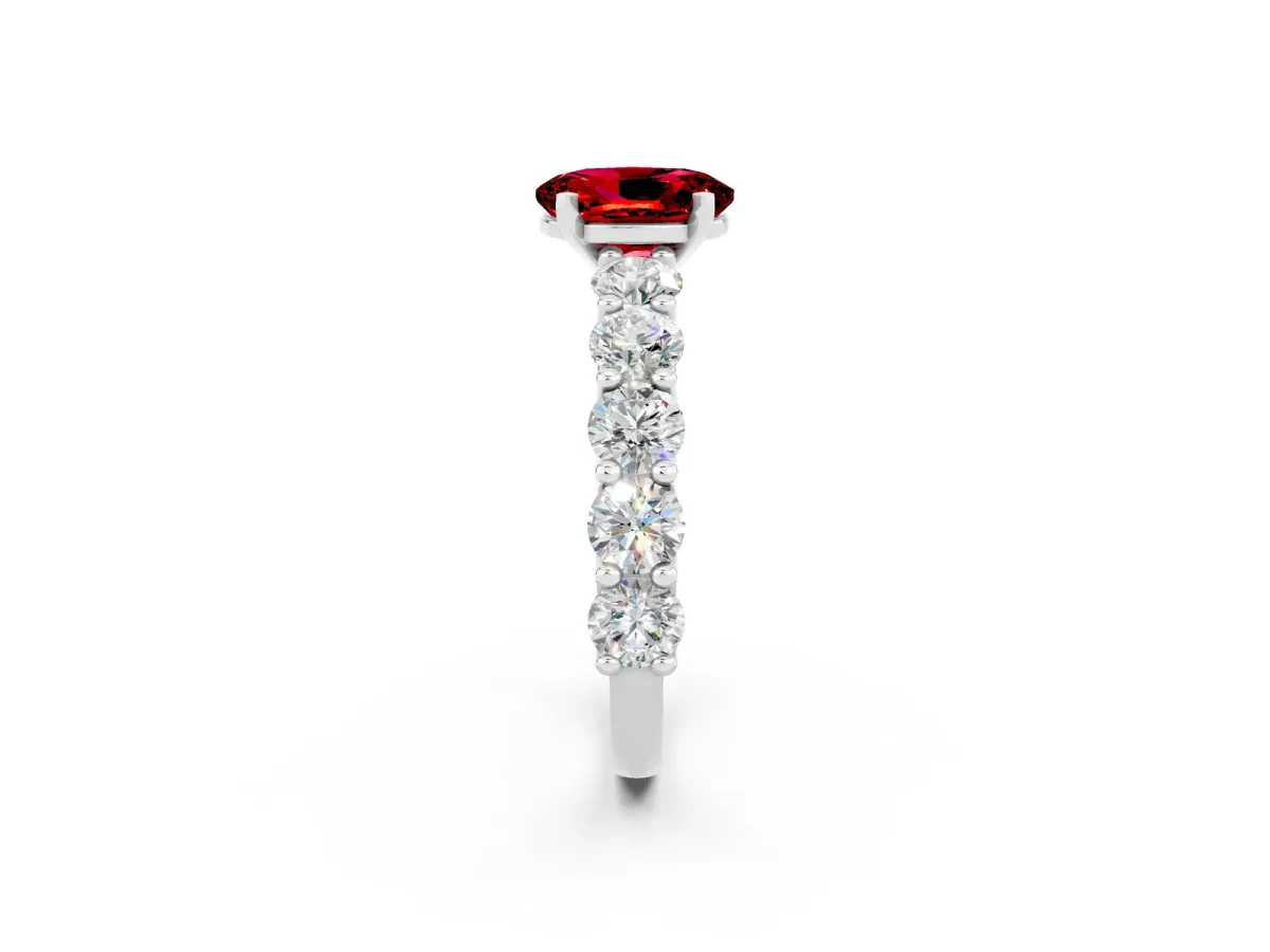 Oval Cut Ruby Prong Setting with Side Stones on a Pave Band Silver