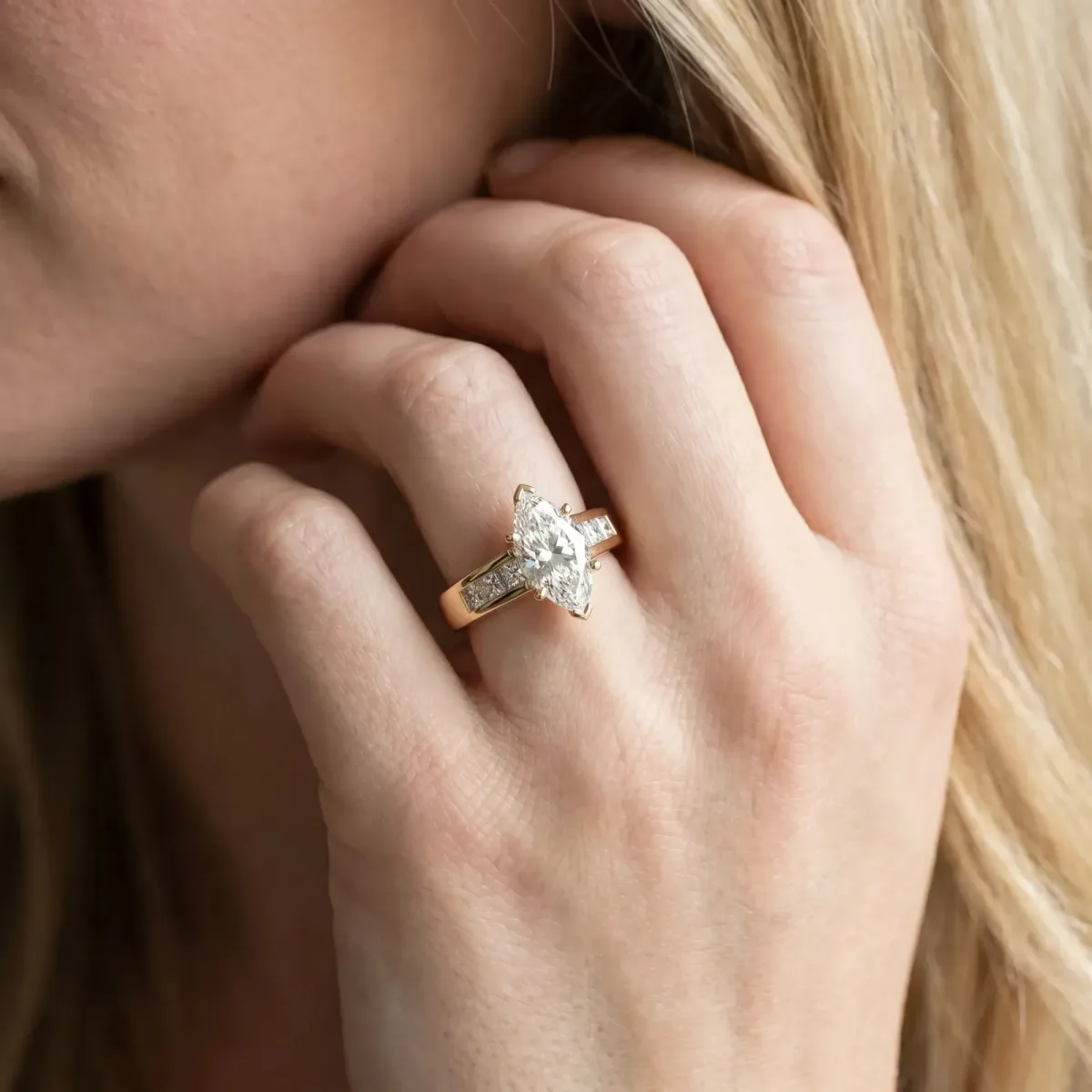 Marquise Cut Cut Channel Set Solitaire Ring with Four-Prong Setting Yellow gold