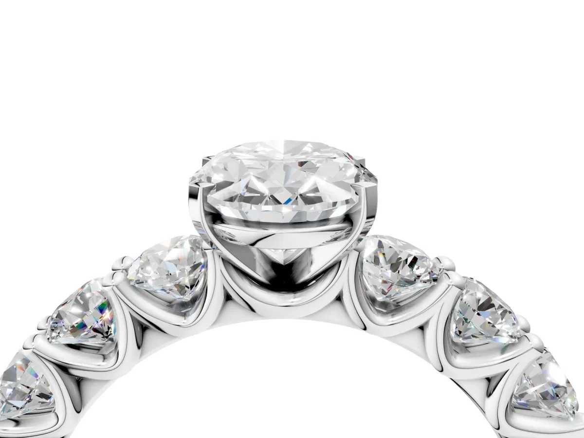 Oval Cut Diamond Prong Setting with Side Stones on a Pave Band Silver