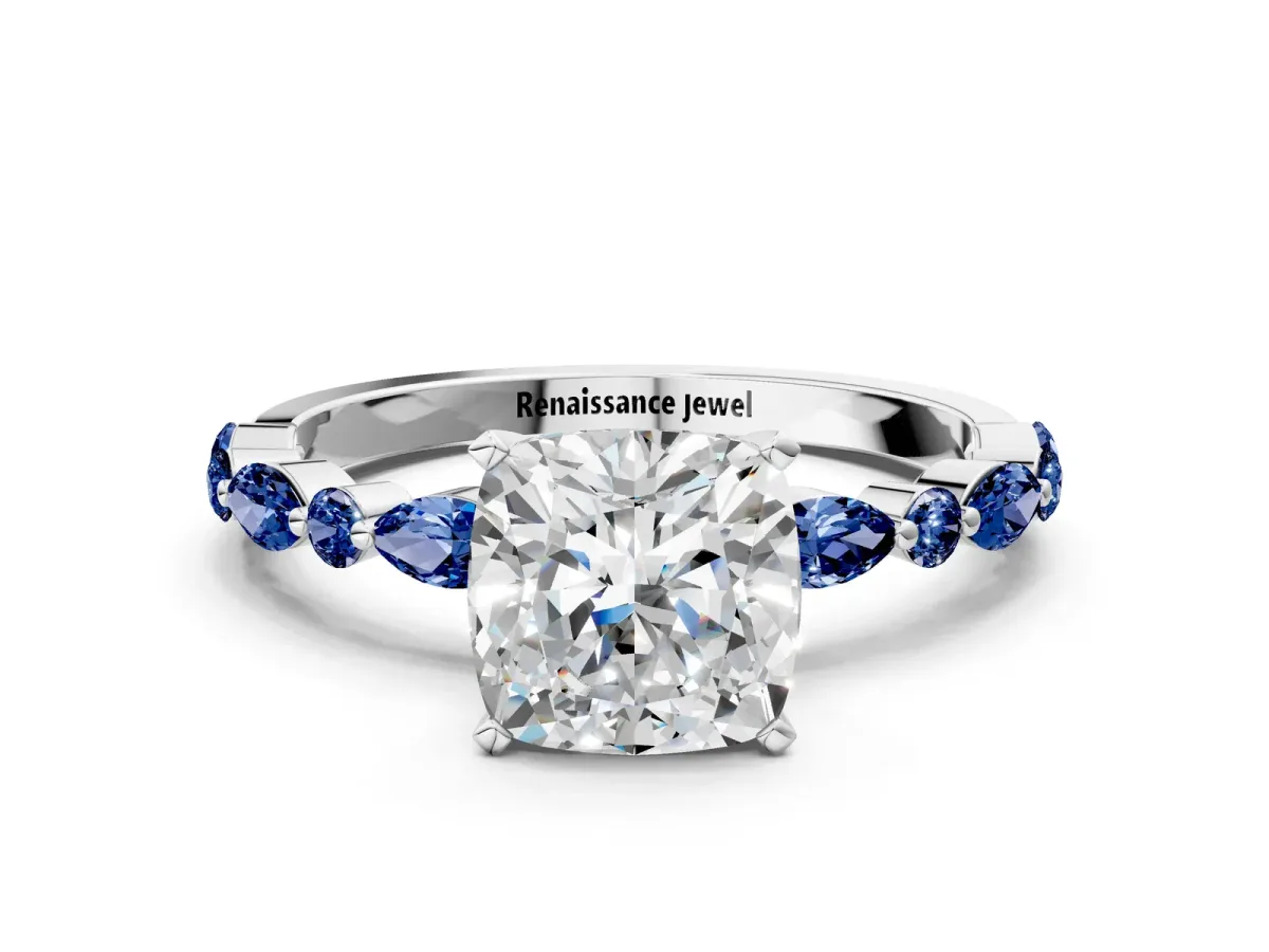 Cushion Cut Diamond Ring with Marquise and Round Blue Sapphire Side Stones and Four-Prong Setting White gold