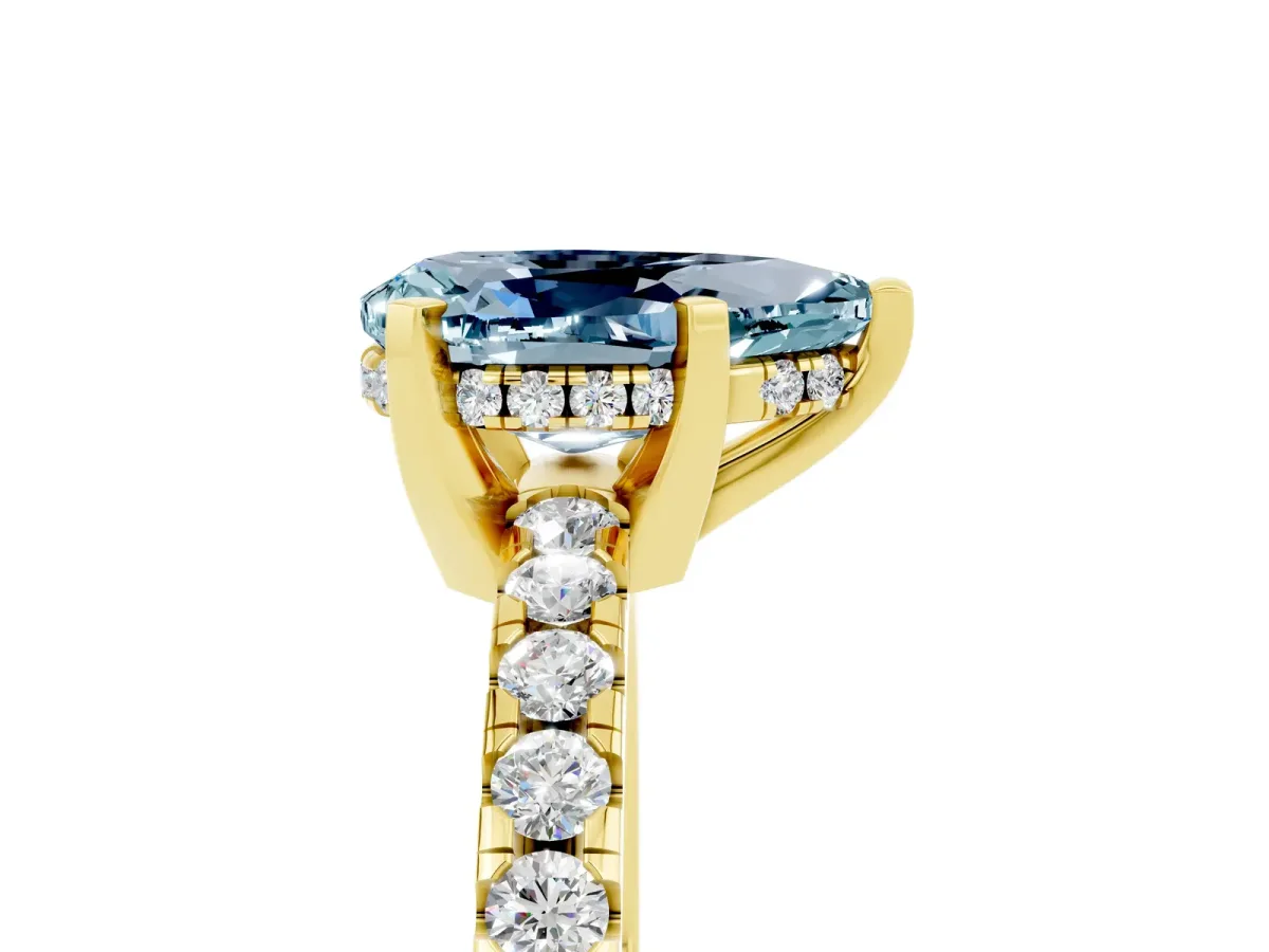 Pear Cut Aquamarine Solitaire Ring with Round Pavé Band and Four-Prong Setting Yellow gold