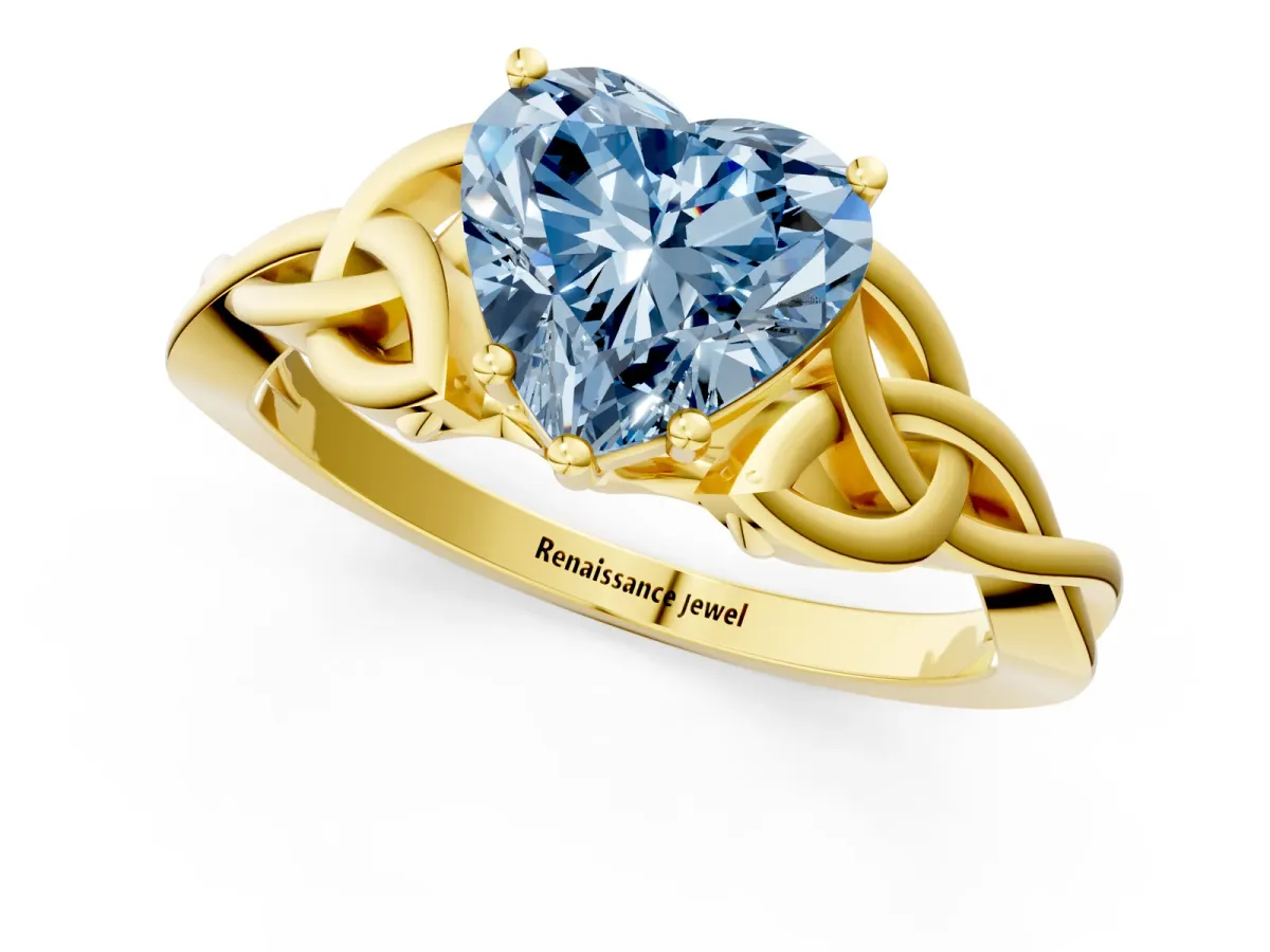 Fancy Blue Heart Cut Diamond Solitaire Engagement Ring with Celtic Knot Band and Four-Prong Setting Yellow gold
