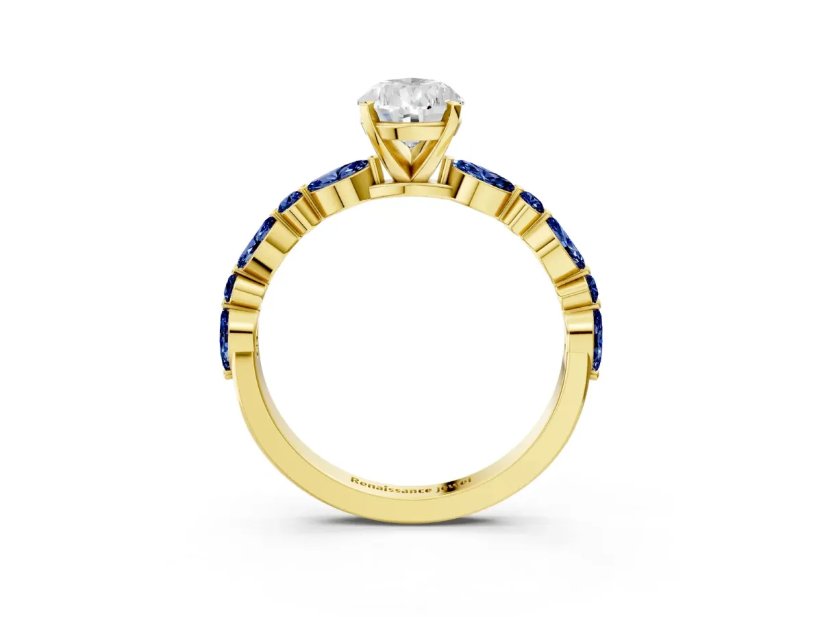 Pear Cut Diamond Ring with Marquise and Round Blue Sapphire Side Stones and Four-Prong Setting Yellow gold