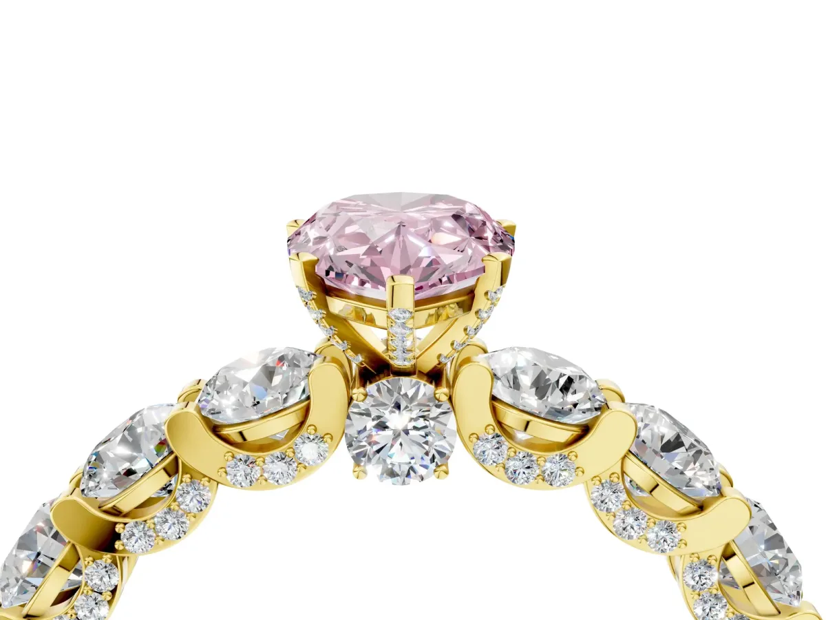 Fancy Pink Pear Cut Diamond Side Stone Engagement Ring with Four-Prong Setting Yellow gold