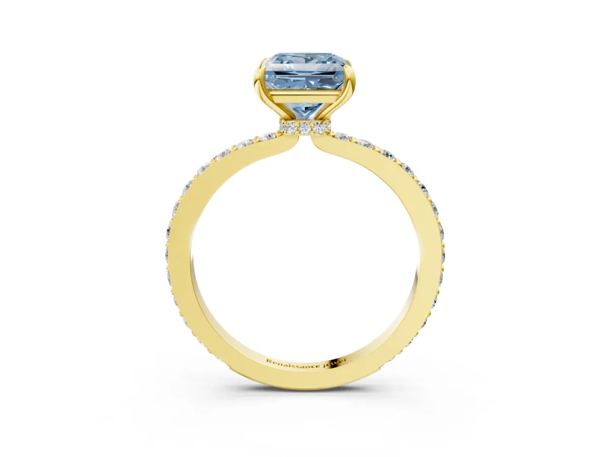 Fancy Blue Princess Cut Diamond Solitaire Engagement Ring with Pavé Band and Four-Prong Setting Yellow gold