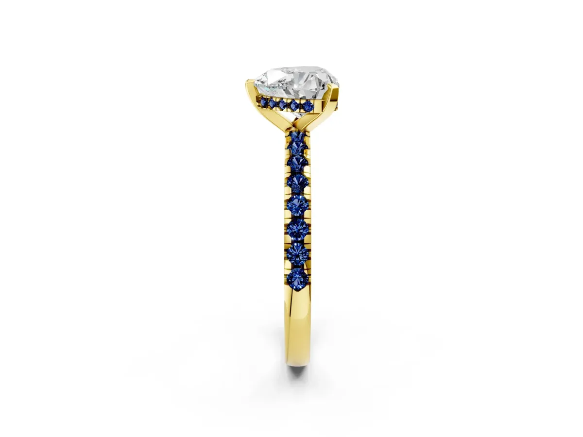Heart Cut Diamond Solitaire Ring with Round Blue Sapphire Pavé Band and Four-Prong Setting Yellow gold