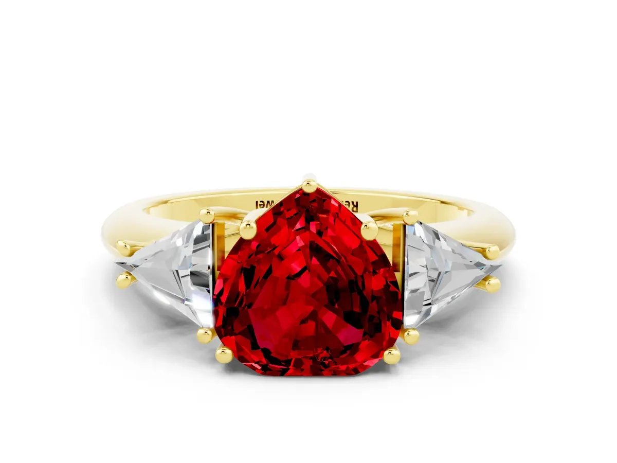 Three-Stone Heart Cut Ruby Engagement Ring with Trillion Side Stones and Prong Setting Yellow gold