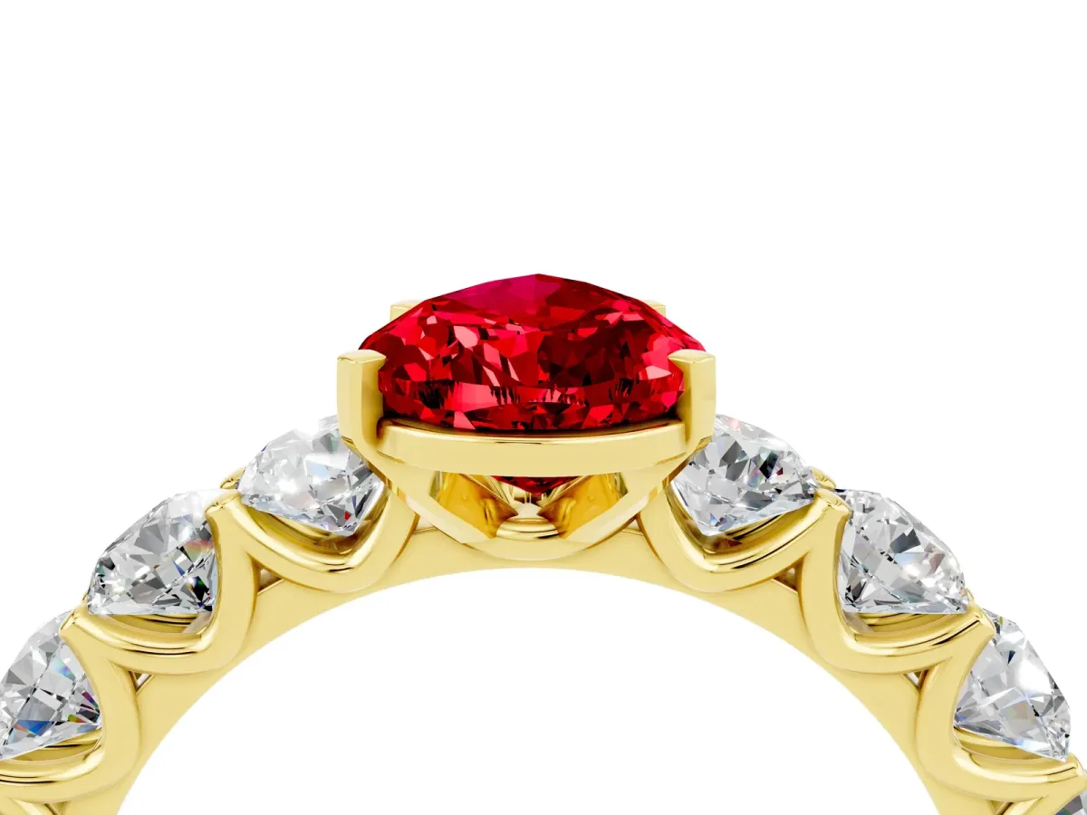 Pear Cut Ruby Prong Setting with Side Stones on a Pave Band Yellow gold