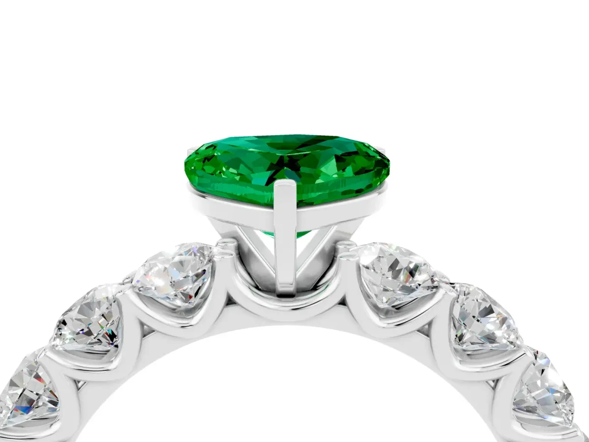 Heart Cut Emerald Prong Setting with Side Stones on a Pave Band Silver