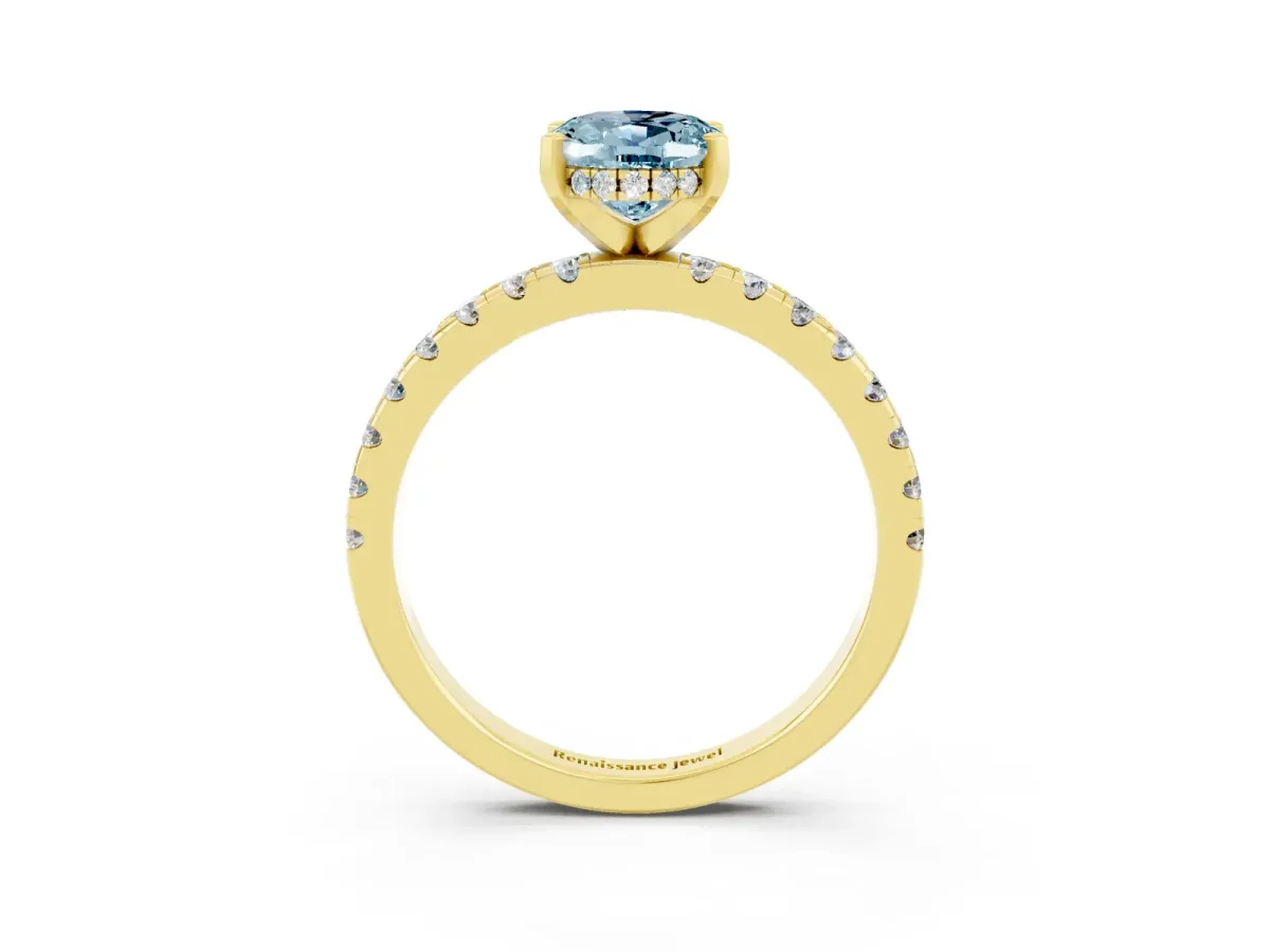 Oval Cut Aquamarine Solitaire Ring with Round Pavé Band and Four-Prong Setting Yellow gold