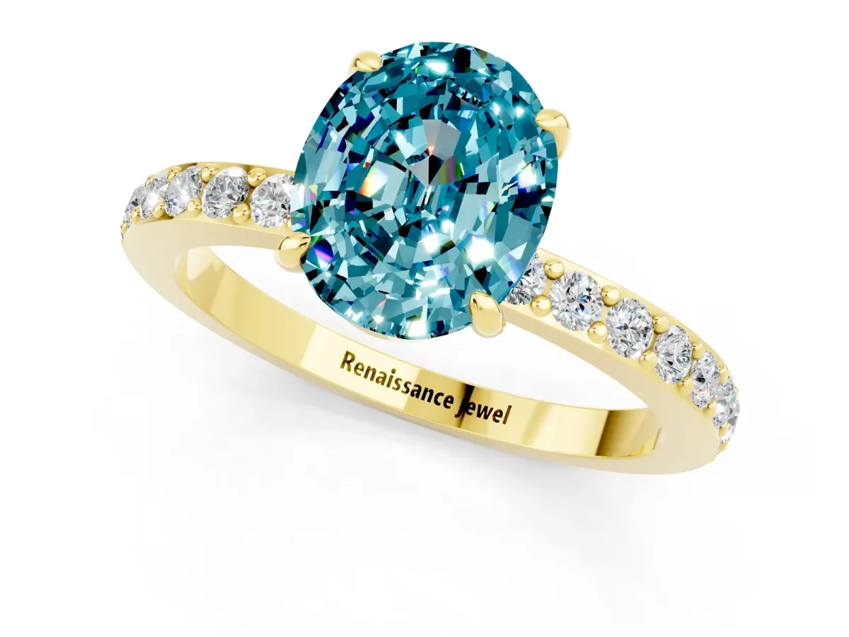 Oval Cut Blue Topaz Solitaire Engagement Ring with Pavé Band and Four-Prong Setting Yellow gold
