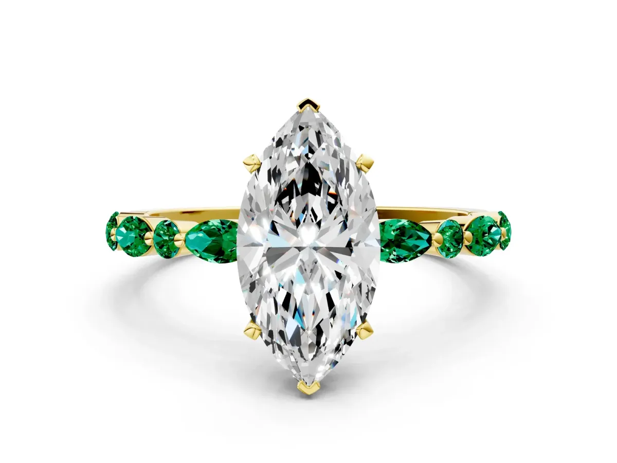 Marquise Cut Diamond Ring with Marquise and Round Emerald Side Stones and Four-Prong Setting Yellow gold