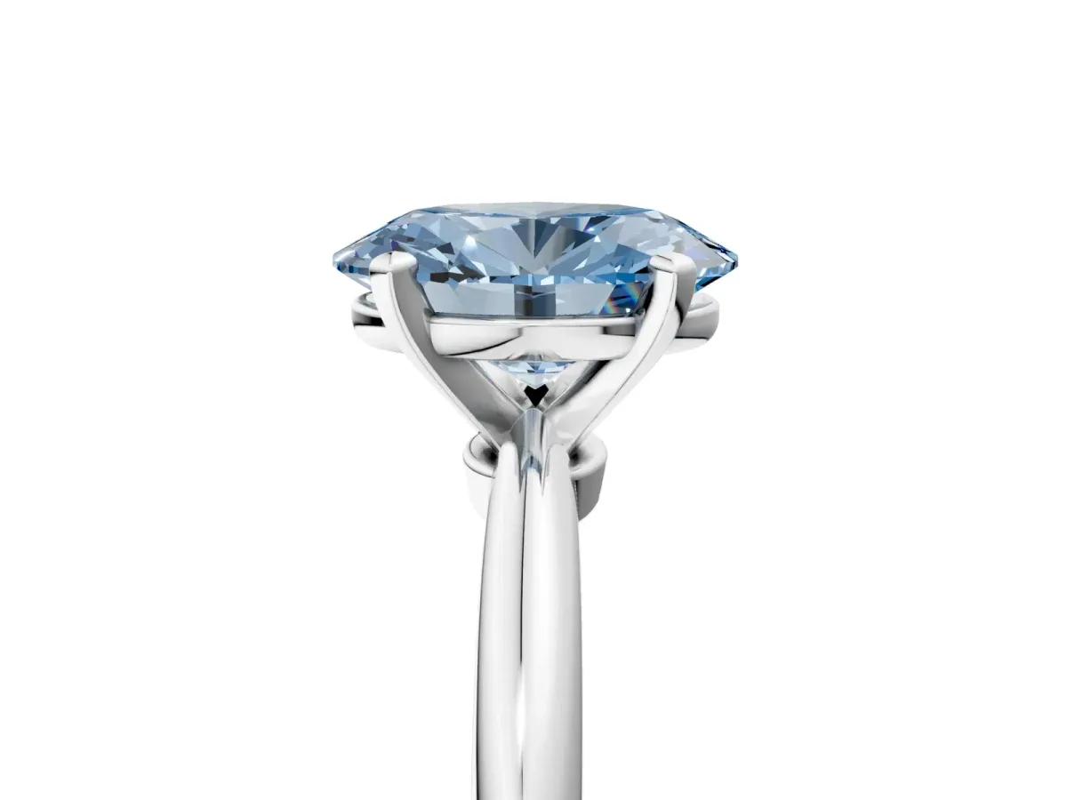 Fancy Blue Oval Cut Diamond Solitaire Ring with Six-Prong Setting and Classic Band Silver