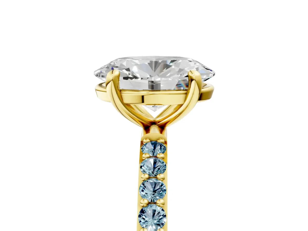 Oval Cut Diamond Solitaire Ring with Round Aquamarine Pavé Band and Prong Setting Yellow gold