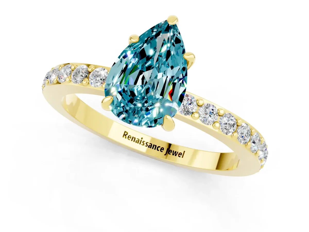 Pear Cut Blue Topaz Solitaire Engagement Ring with Pavé Band and Four-Prong Setting Yellow gold