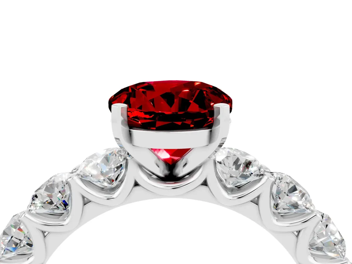 Round Cut Ruby Prong Setting with Side Stones on a Pave Band White gold