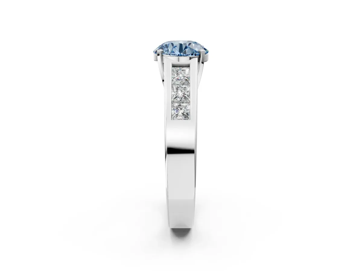 Fancy Blue Round Cut Cut Channel Set Solitaire Ring with Four-Prong Setting Silver