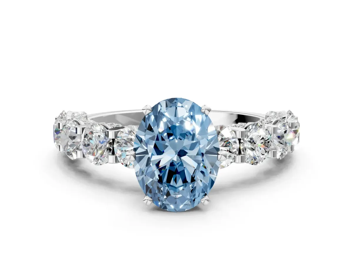 Fancy Blue Oval Cut Diamond Side Stone Engagement Ring with Four-Prong Setting White gold