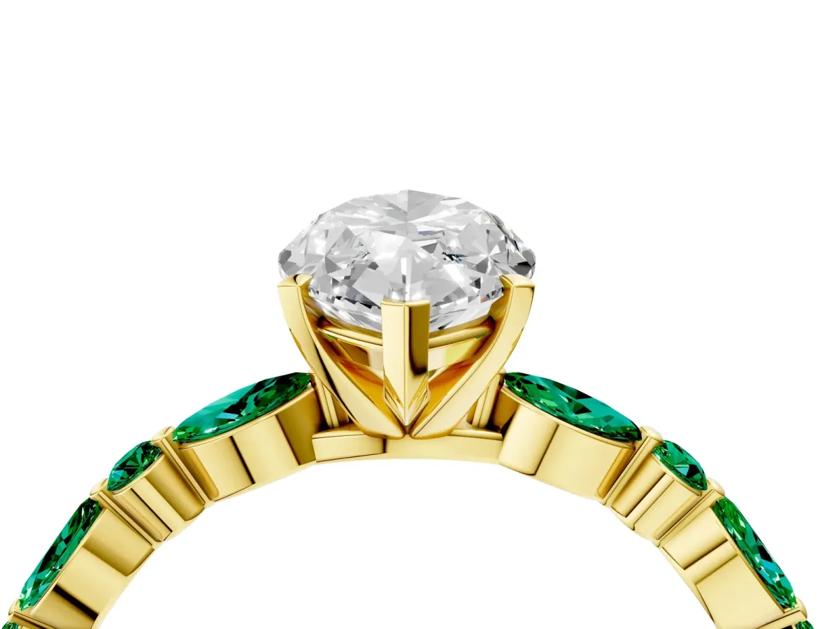 Marquise Cut Diamond Ring with Marquise and Round Emerald Side Stones and Four-Prong Setting Yellow gold