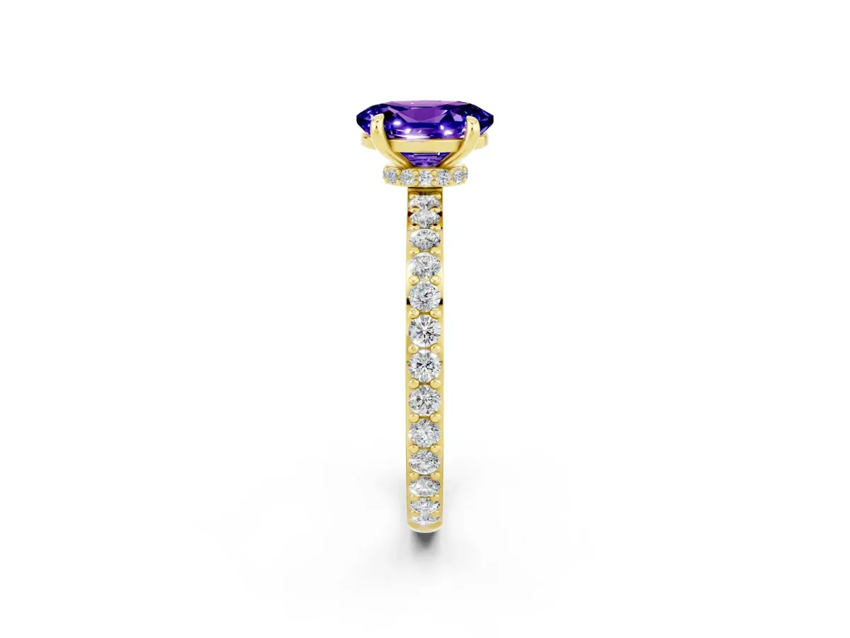 Oval Cut Tanzanite Solitaire Engagement Ring with Pavé Band and Four-Prong Setting Yellow gold