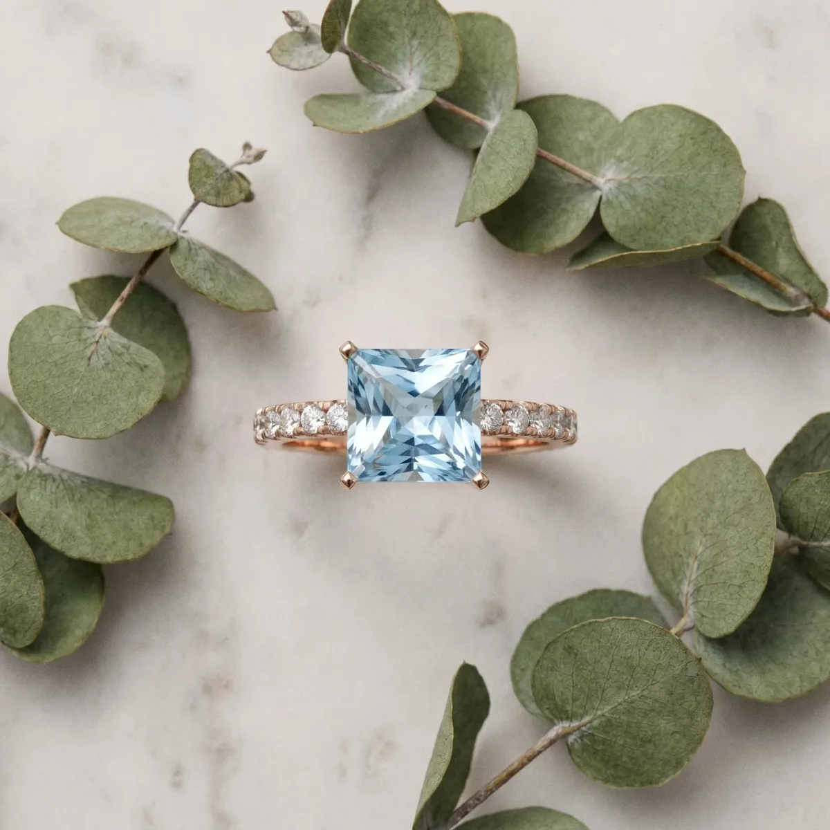 Princess Cut Aquamarine Solitaire Ring with Round Pavé Band and Four-Prong Setting Rose gold