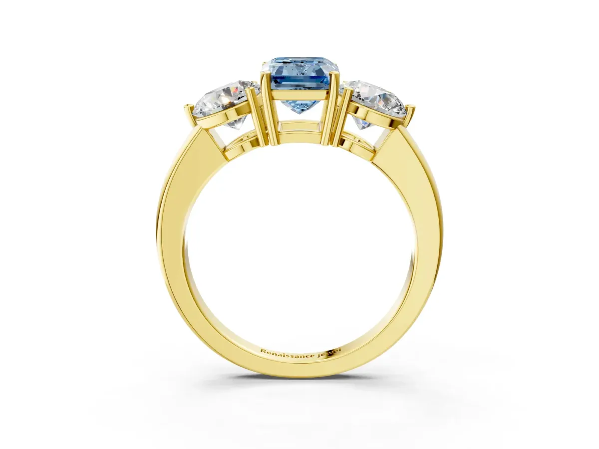 Fancy Blue Emerald Cut Diamond Three-Stone Ring with Prong Setting and Classic Band Yellow gold