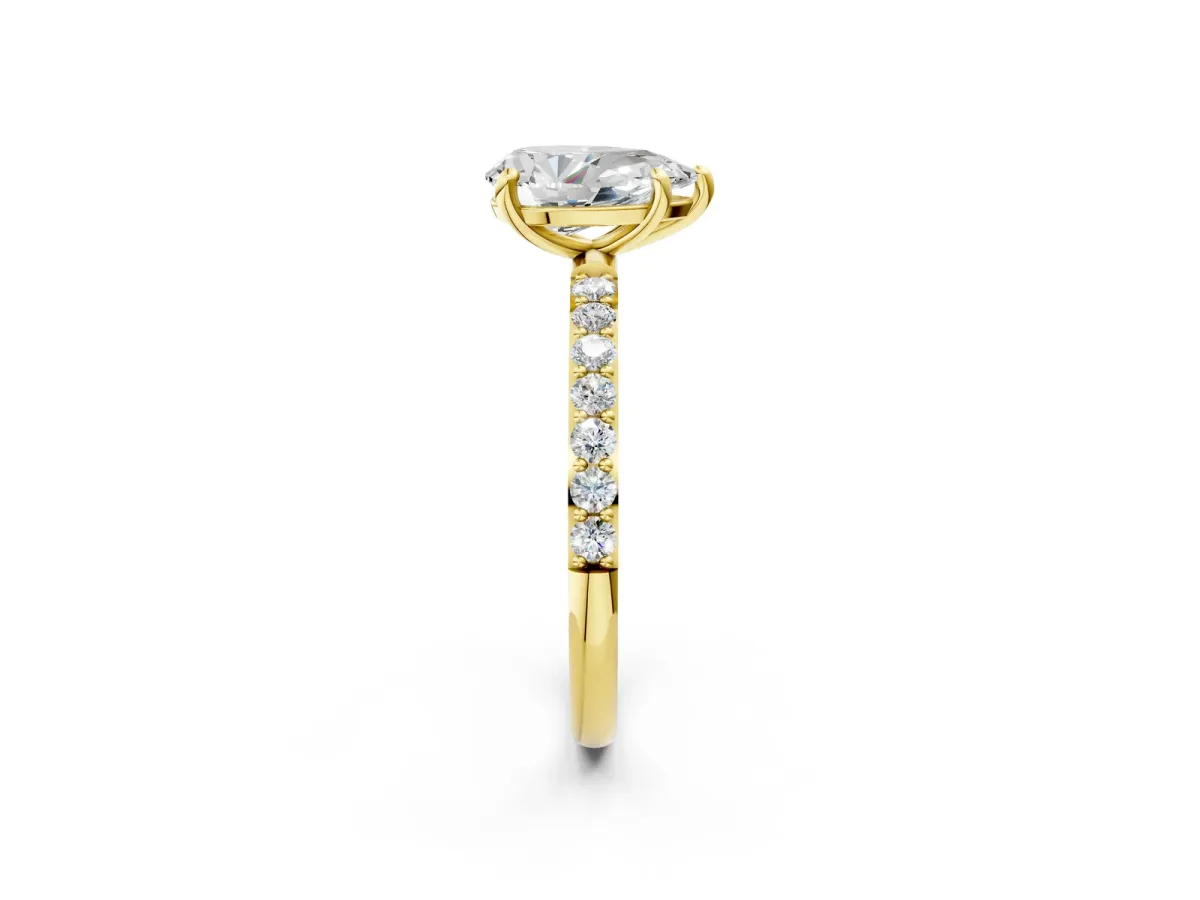 Pear Cut Diamond Solitaire Ring with Round Moissanite Pavé Band and Prong Setting Yellow gold