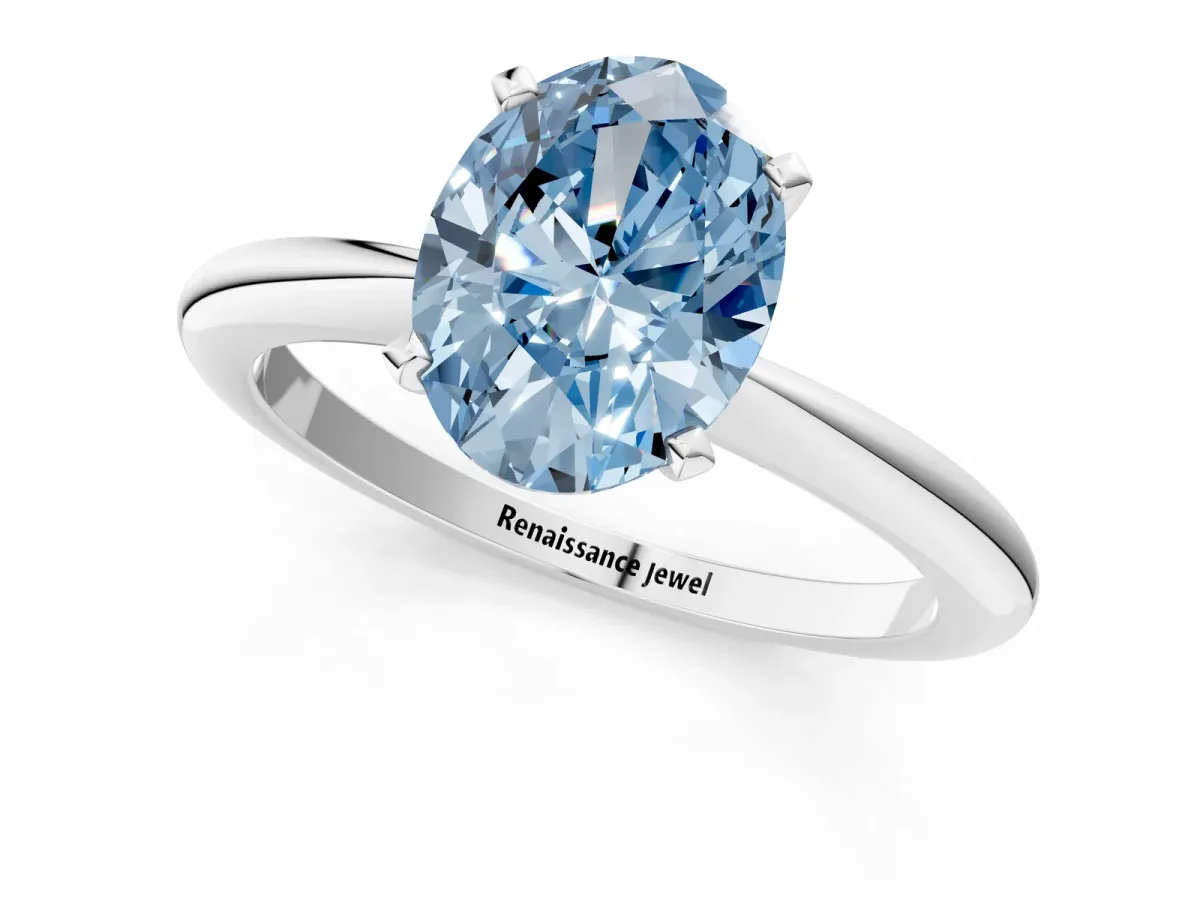 Fancy Blue Oval Cut Diamond Solitaire Ring with Six-Prong Setting and Classic Band Silver