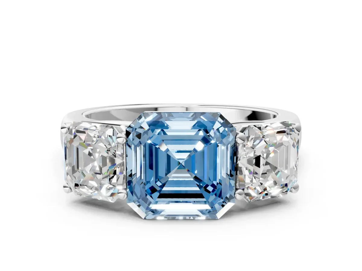 Fancy Blue Asscher Cut Three-Stone Diamond Ring with Prong Setting on a Classic Band Platinum