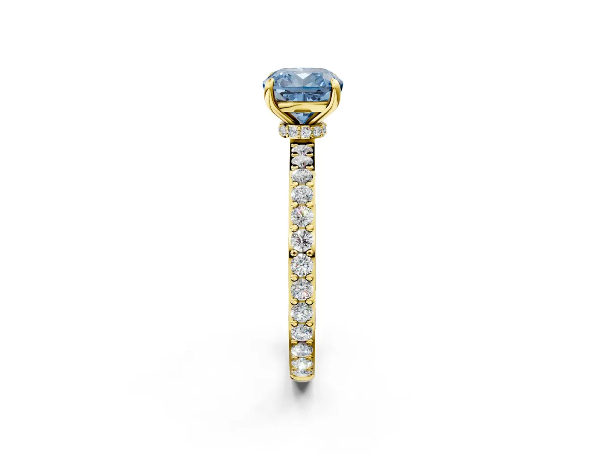 Fancy Blue Cushion Cut Diamond Solitaire Engagement Ring with Pavé Band and Four-Prong Setting Yellow gold